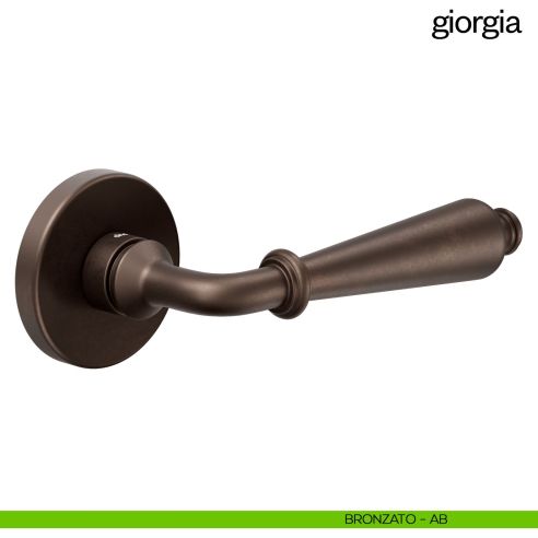 Maniglia per porta Giorgia Dnd Handles con rosetta tonda bronzato