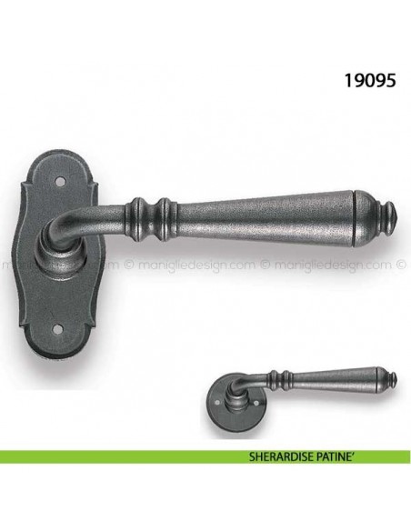 Maniglia in ferro per porta Metal Style 19095 con rosetta ovale sherardise patinè