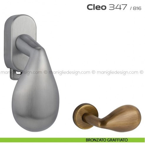 Maniglia per finestra DK con pulsante su placca 347 Cleo Reguitti bronzato graffiato