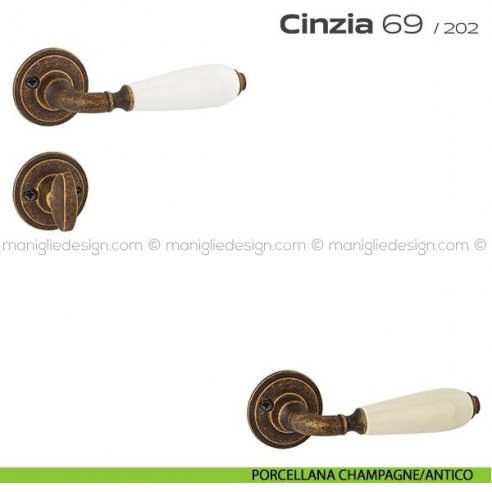 Maniglia in porcellana per porta con nottolino 069 Cinzia Reguitti con viti a vista porcellana champagne/antico