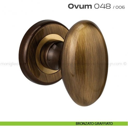 Pomolo ovale per porta girevole 048 Ovum Reguitti con rosetta tonda ad avvitare bronzato graffiato