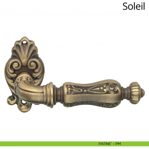 Maniglia per porta interna Soleil Linea Calì con rosetta artistica patinè