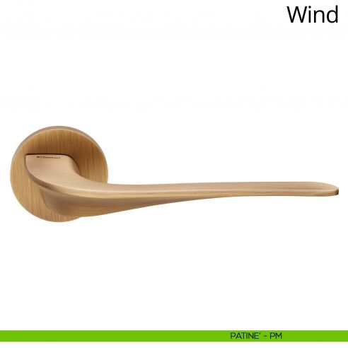 Maniglia per porta interna Wind Linea Calì rosetta tonda bassa patinè