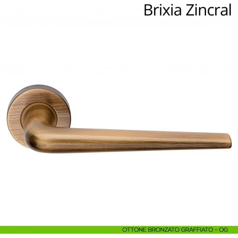 Maniglia per porta interna Brixia Zincral Linea Calì rosetta tonda ottone bronzato graffiato