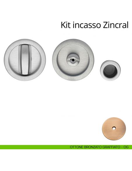 Kit maniglia incasso tonda con nottolino, taglio vite e maniglia di trascinamento Zincral Linea Calì ottone bronzato graffiato