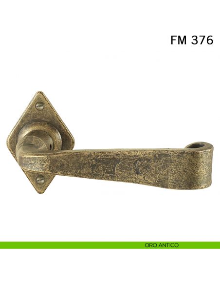 Maniglia in ferro per porta Il Forgiato FM 376 con molla oro antico